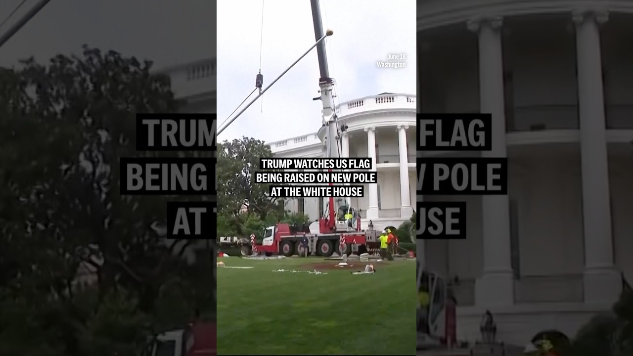 Trump watches US flag being raised on new pole at the White House